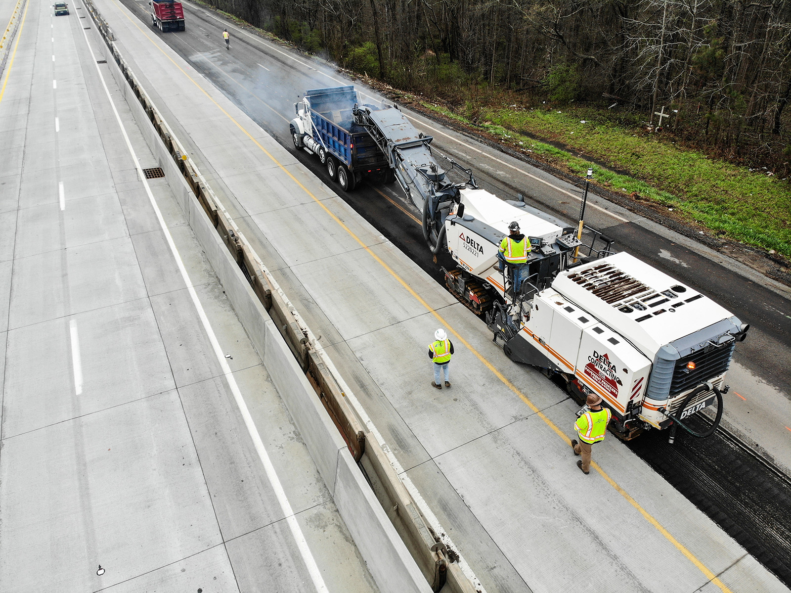 Aerial view of Delta Contracting performing 3D Milling along a highway